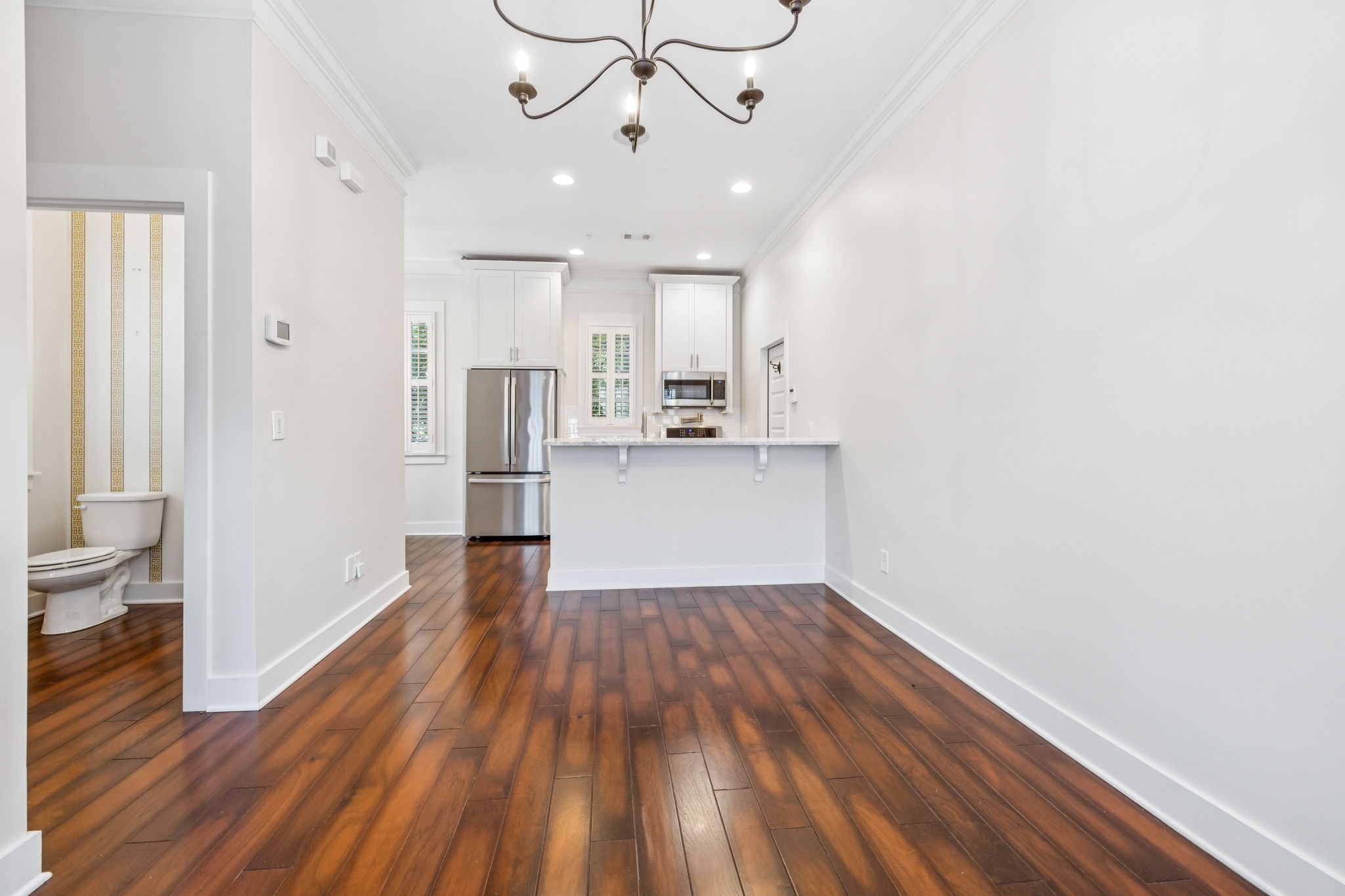 100 Cottage Lane Franklin, TN 37064 - Photo 9 of 64 a view of a kitchen with wooden floor and a refrigerator