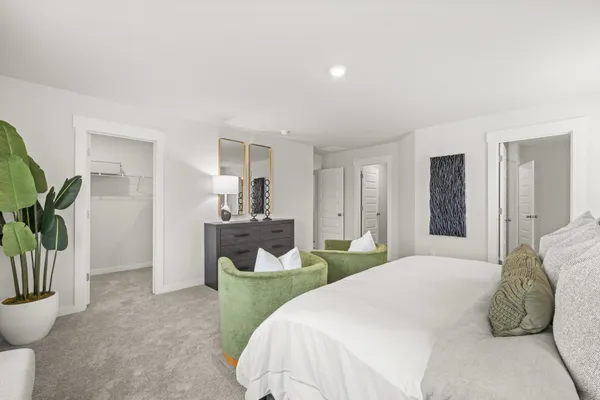 a front view of a house with a garden and yard