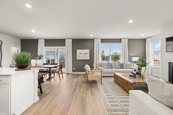 a kitchen with granite countertop a sink stainless steel appliances and cabinets