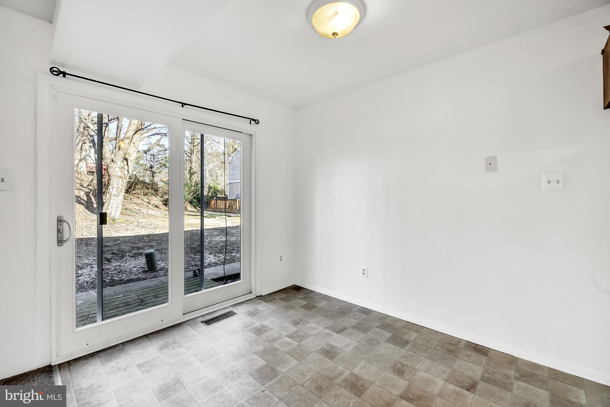 72 Ridgelawn Road, Unit D Reisterstown, MD 21136 - Photo 12 of 28 Dining room w/sliding door leading to patio
