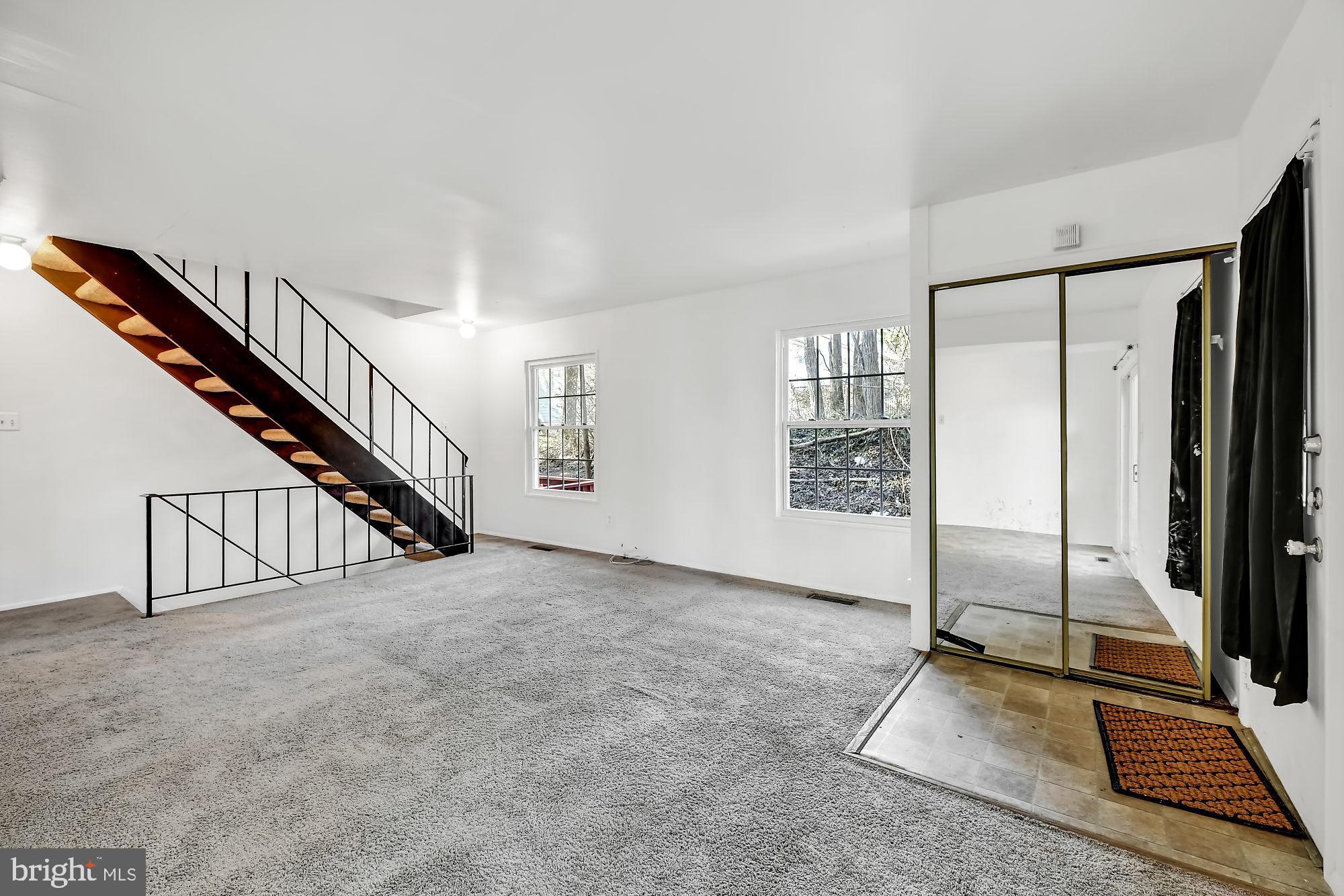72 Ridgelawn Road, Unit D Reisterstown, MD 21136 - Photo 3 of 28 Entry area, living room and stairs