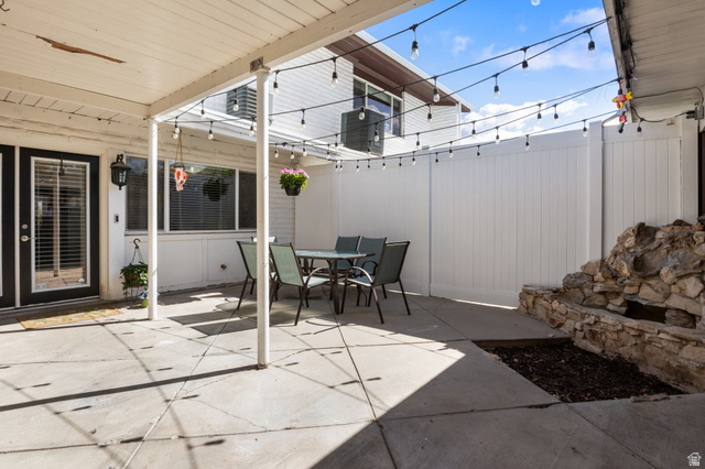 41 Benchmark Village Tooele, UT 84074 - Photo 24 of 26 Fenced backyard with outdoor dining area and a patio area