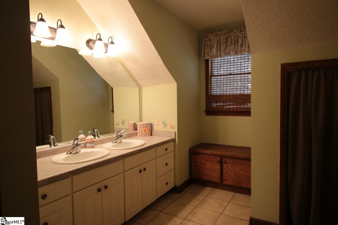 139 Cove Road Clinton, SC 29325 - Photo 13 of 17 Upstairs bath with double vanities and lots of storage