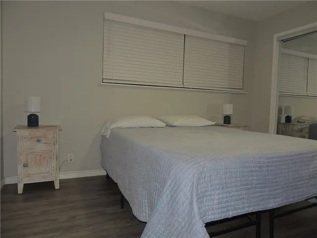 a bedroom with a bed and a cabinets