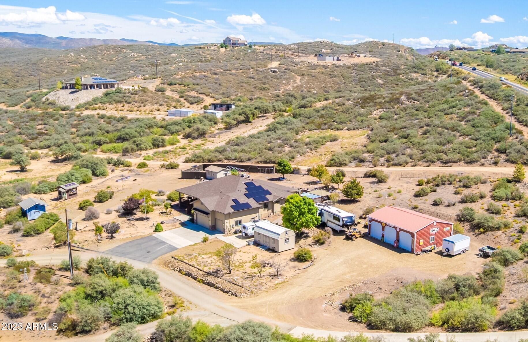 an aerial view of residential houses with outdoor space