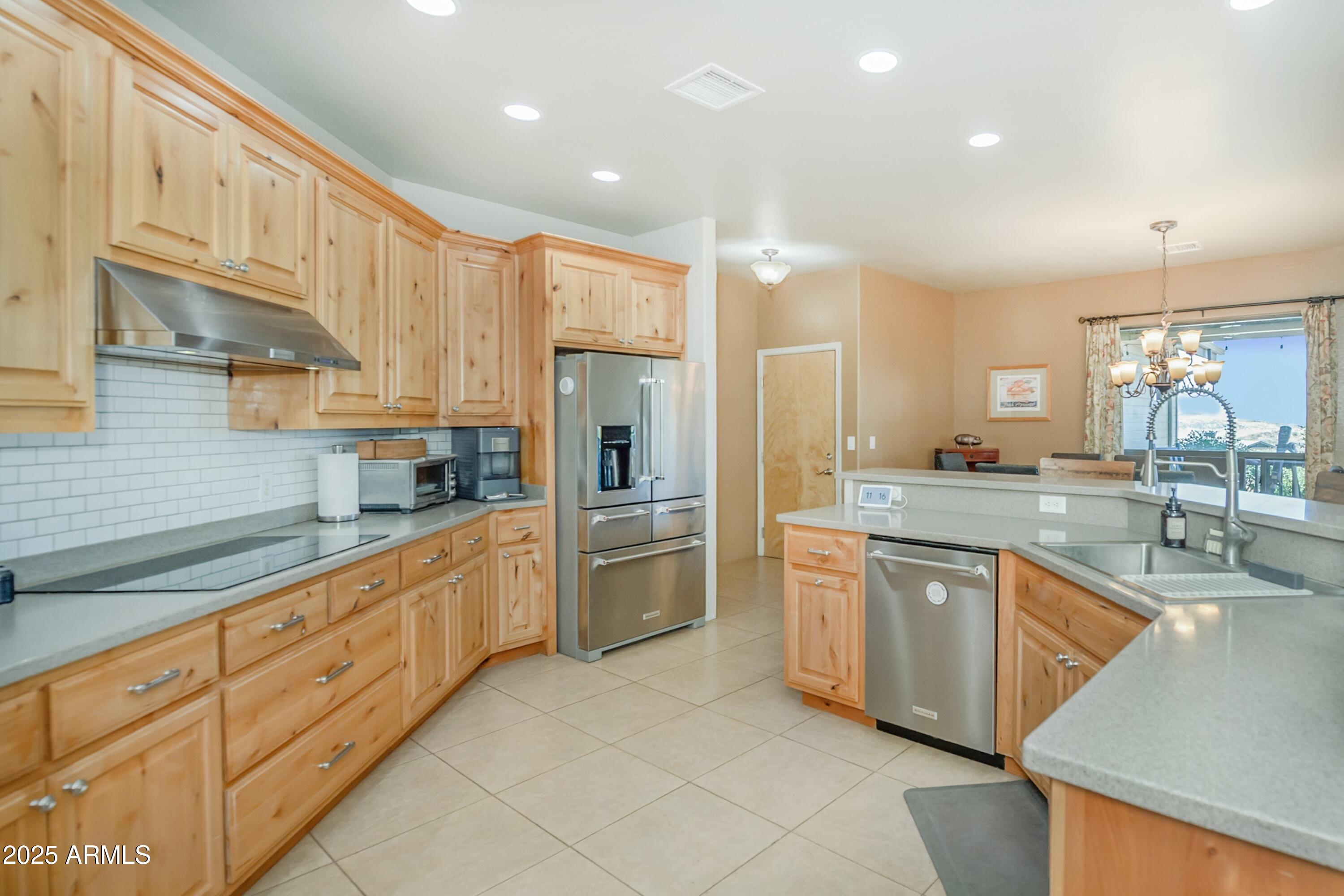 171 South Enchanted Road Dewey, AZ 86327 - Photo 12 of 62 a large kitchen with stainless steel appliances lots of counter space cabinets and a sink