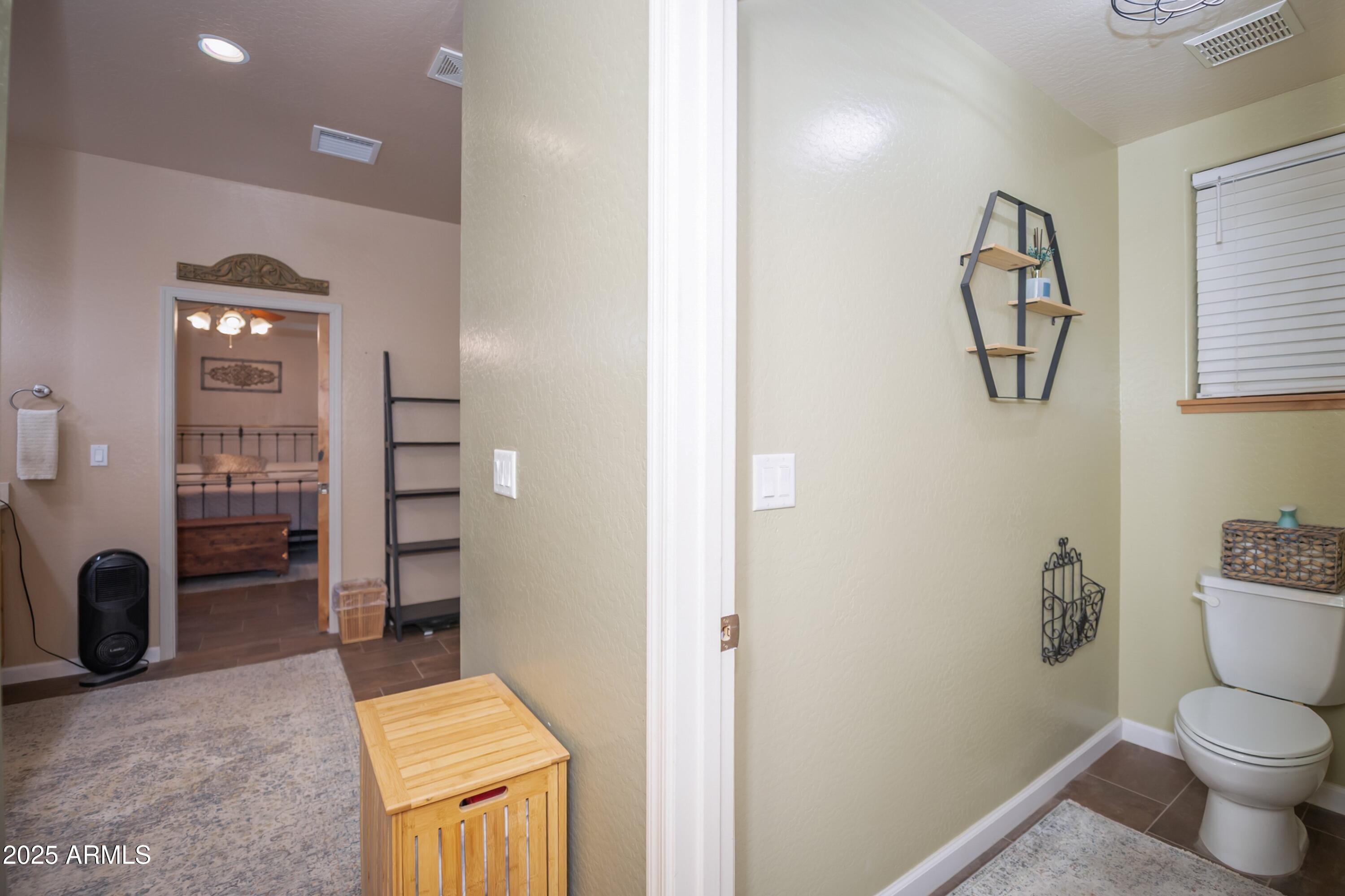 171 South Enchanted Road Dewey, AZ 86327 - Photo 16 of 62 a bathroom with a toilet sink and shower