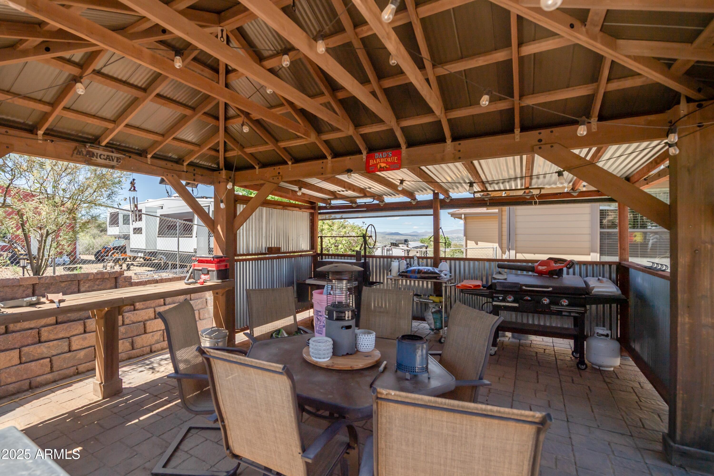 171 South Enchanted Road Dewey, AZ 86327 - Photo 43 of 62 a view of a patio with table and chairs