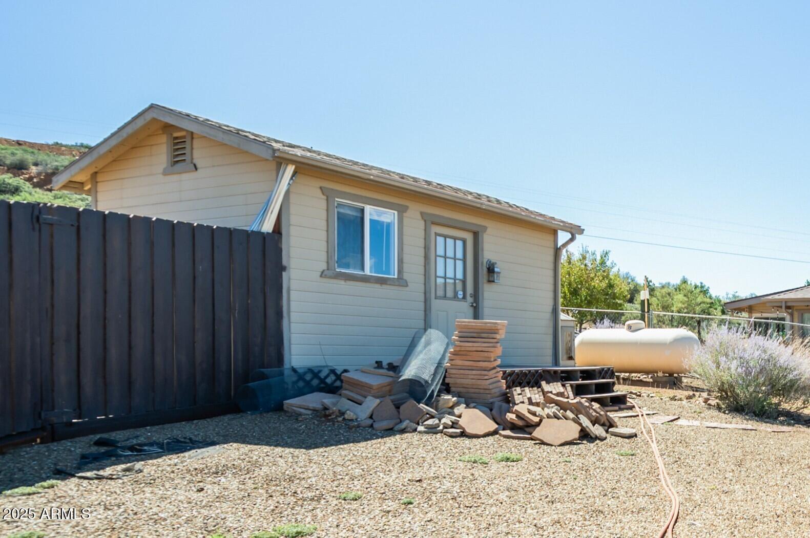 171 South Enchanted Road Dewey, AZ 86327 - Photo 50 of 62 a backyard of a house with table and chairs