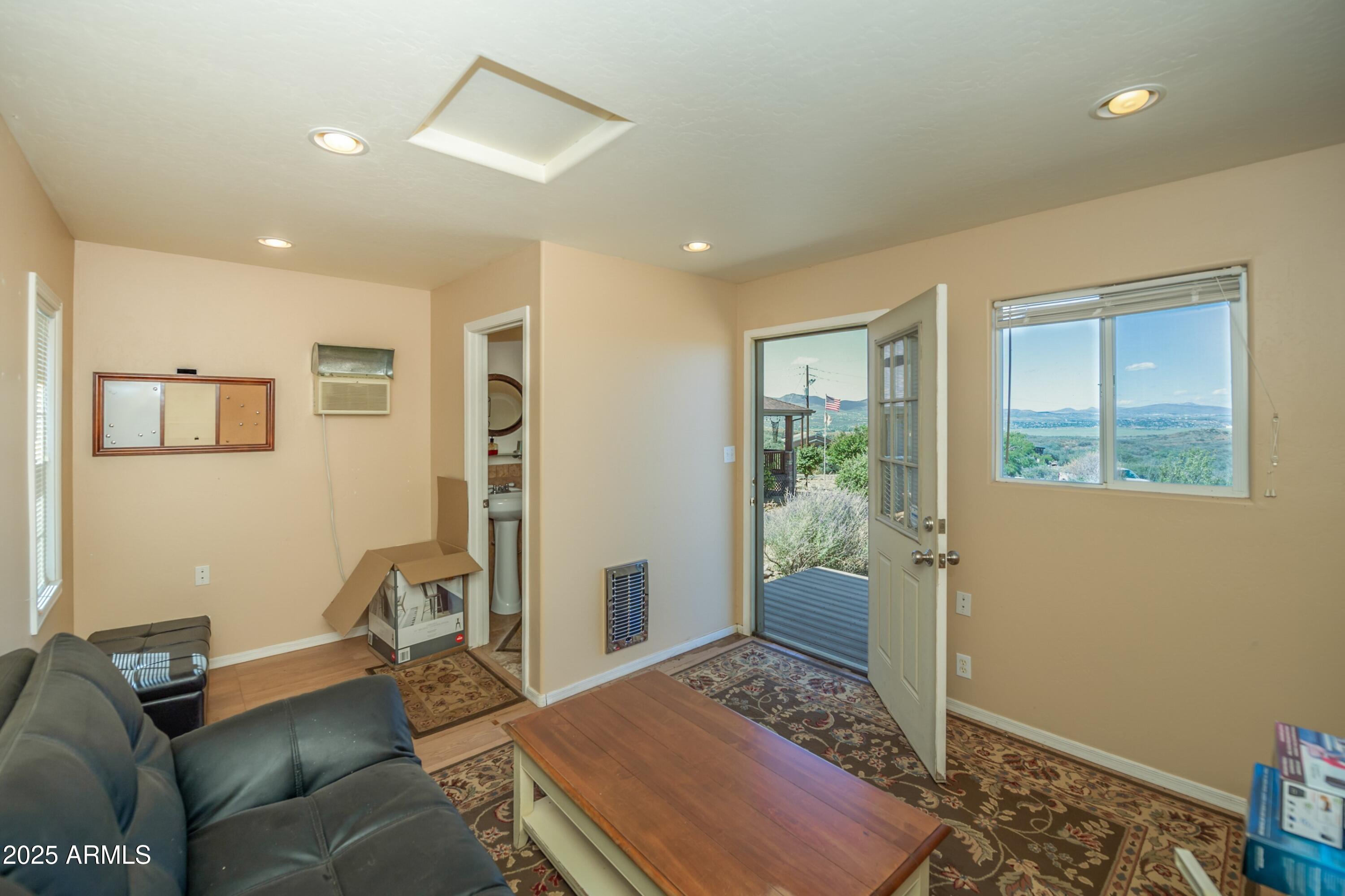171 South Enchanted Road Dewey, AZ 86327 - Photo 51 of 62 a bedroom with furniture and a window