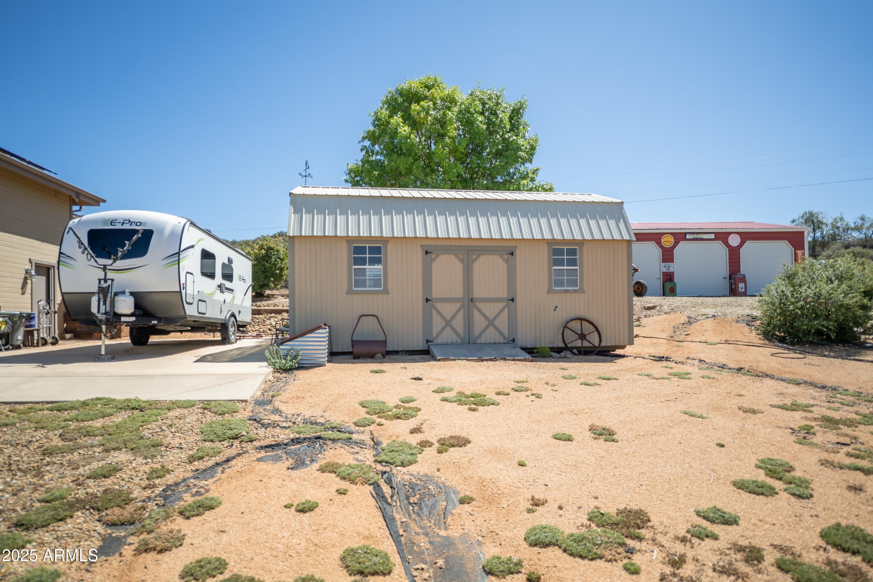 171 South Enchanted Road Dewey, AZ 86327 - Photo 54 of 62 a front view of a house with a wooden fence