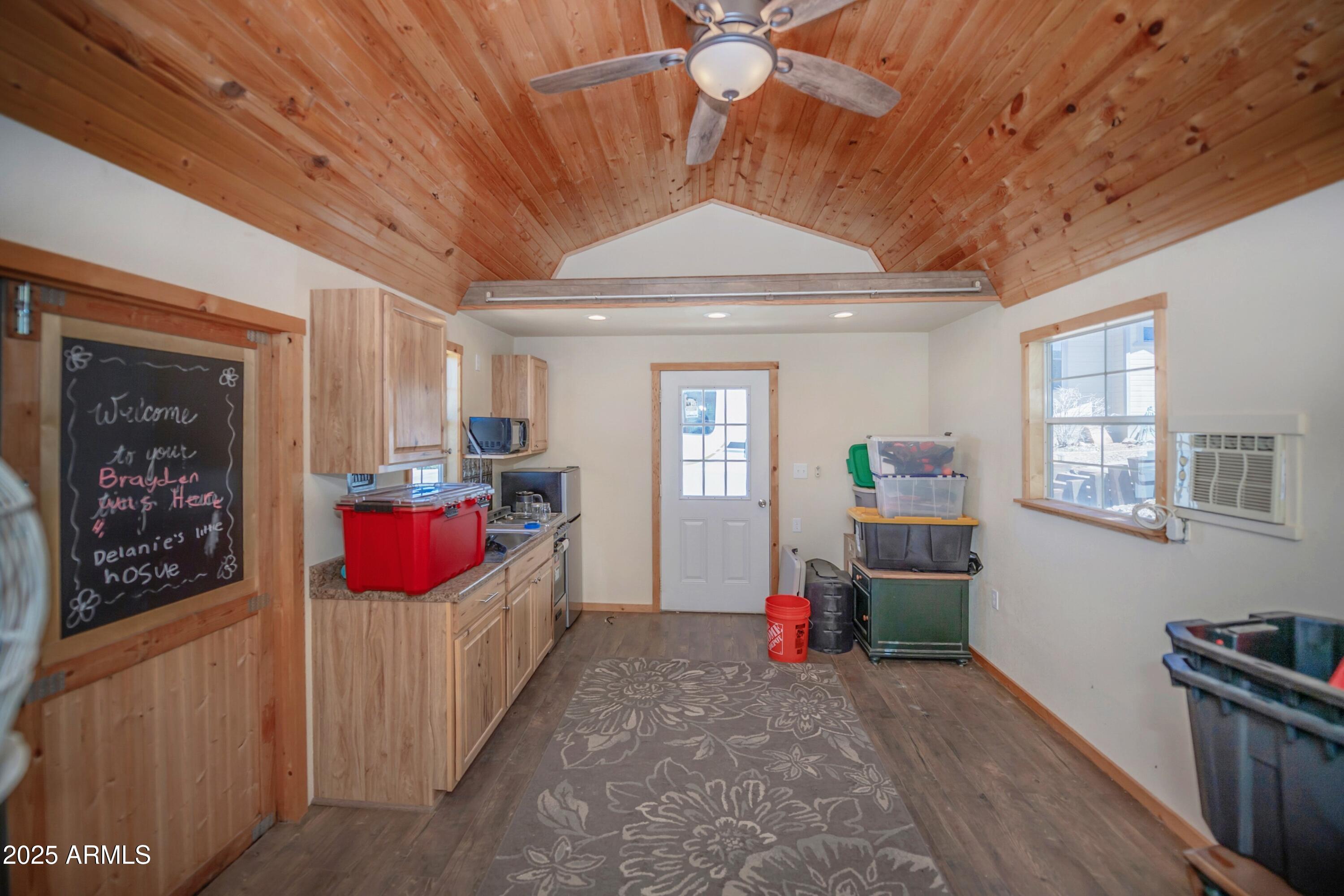 171 South Enchanted Road Dewey, AZ 86327 - Photo 55 of 62 a living room with furniture and a wooden floor