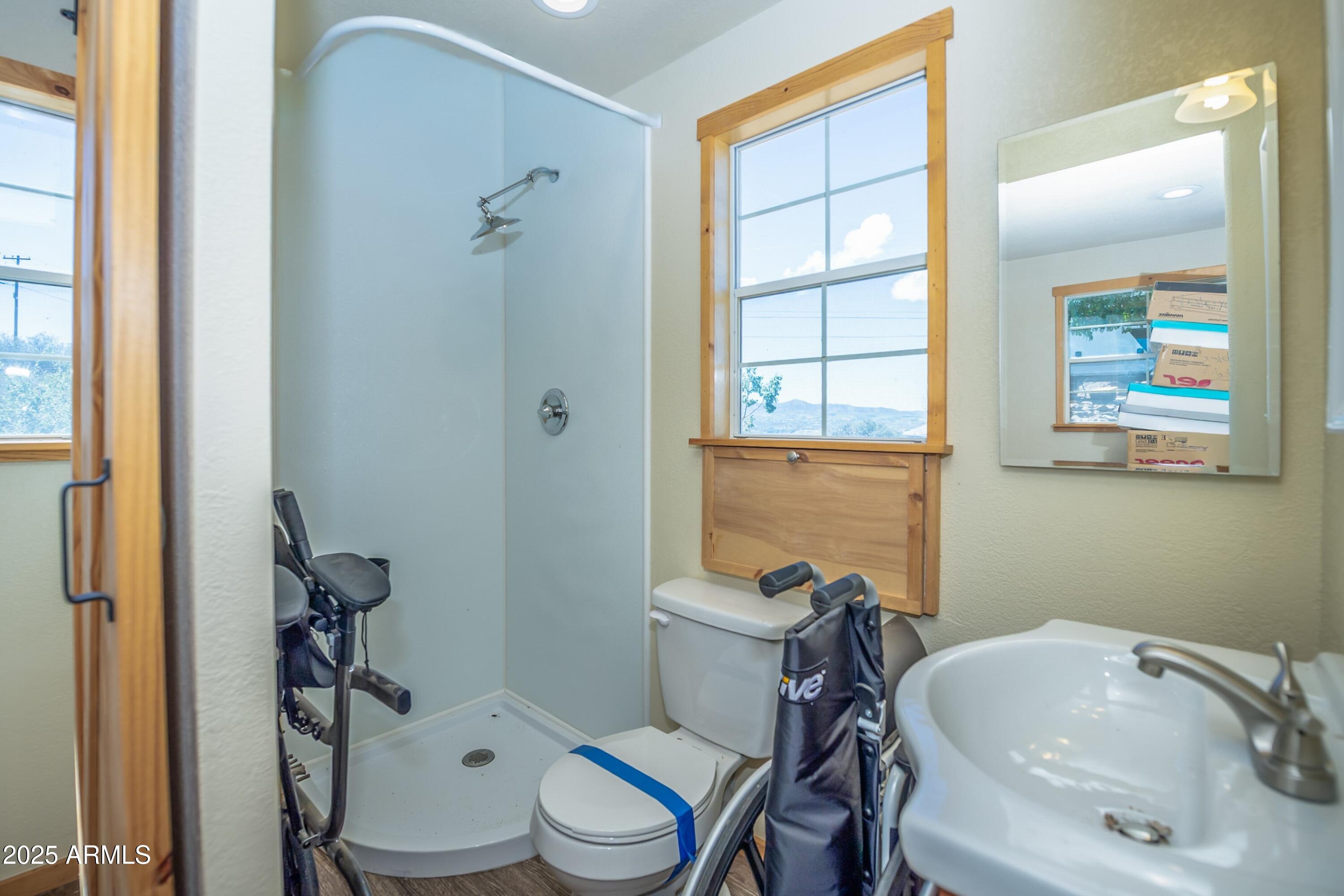 171 South Enchanted Road Dewey, AZ 86327 - Photo 57 of 62 a bathroom with a sink toilet and shower