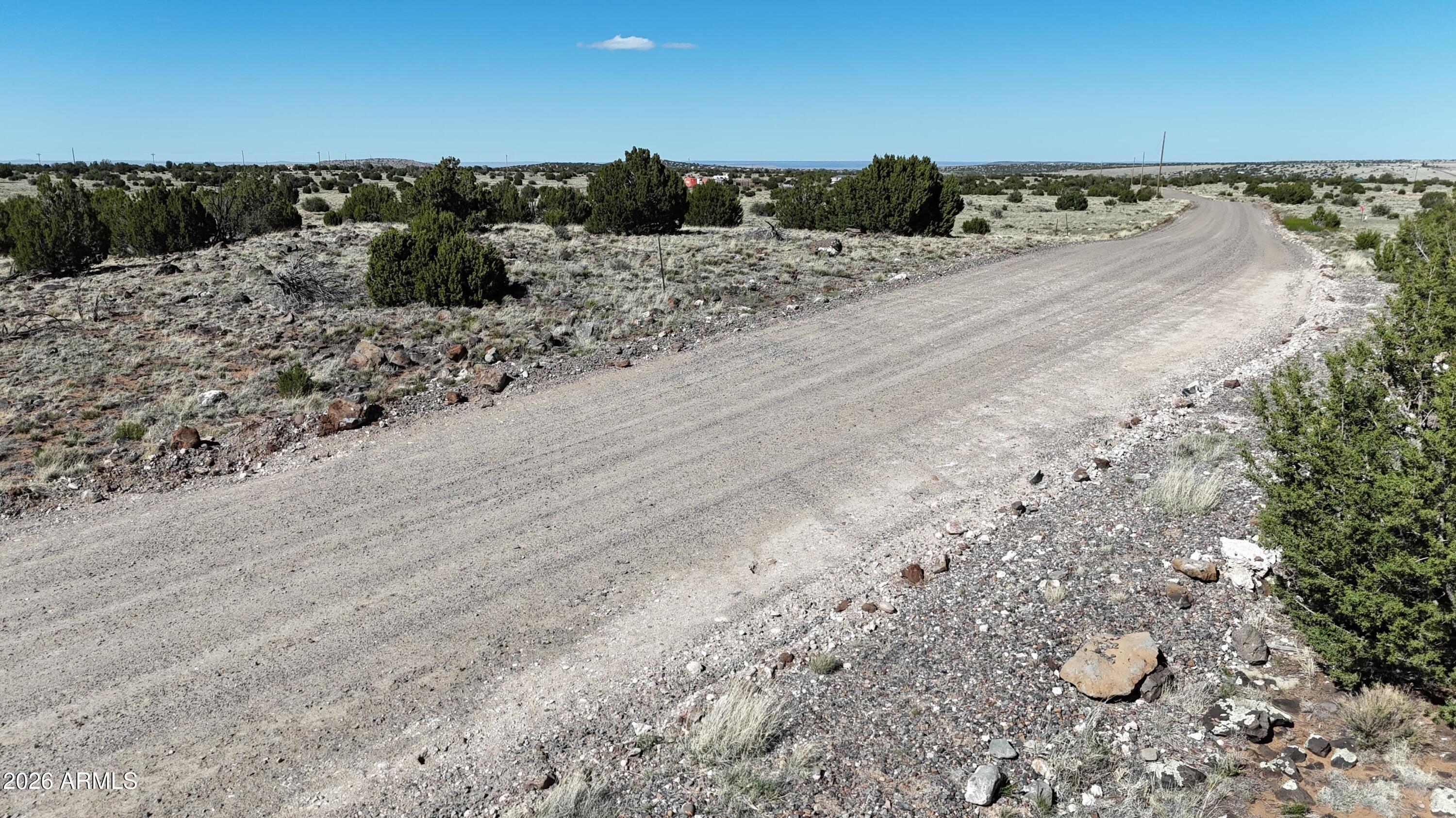 Tbd Tbd Windsor Valley Ranch, Unit 142 Concho, AZ 85924 - Photo 17 of 23 a view of a dry yard with wooden fence