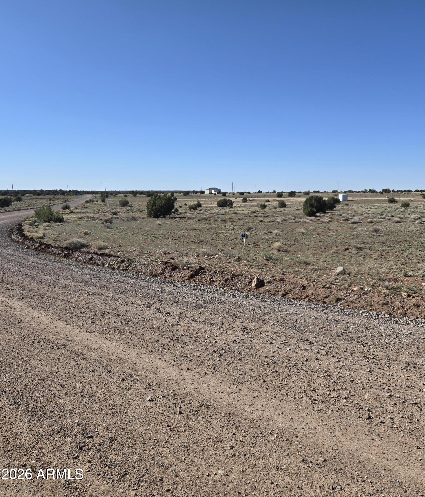 Tbd Tbd Windsor Valley Ranch, Unit 142 Concho, AZ 85924 - Photo 10 of 23 an view of a dry yard with wooden fence