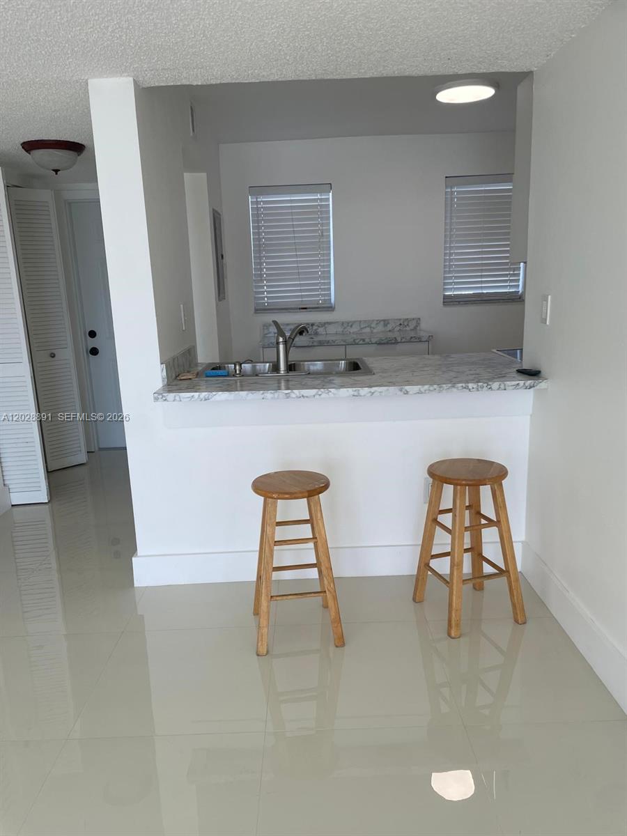 14170 Southwest 84th Street, Unit 402F Miami, FL 33183 - Photo 16 of 36 Kitchen View From Dining Room.