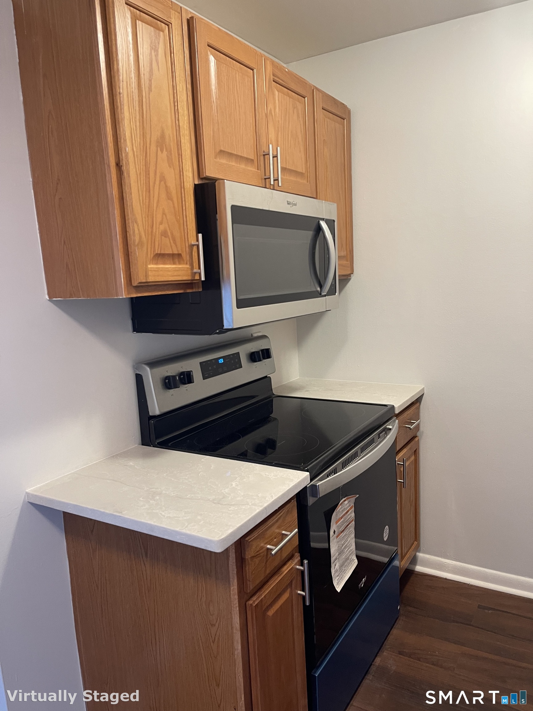 45 Monroe Street, Unit B2 Bridgeport, CT 06605 - Photo 9 of 12 a kitchen with stainless steel appliances granite countertop a stove a microwave and a microwave