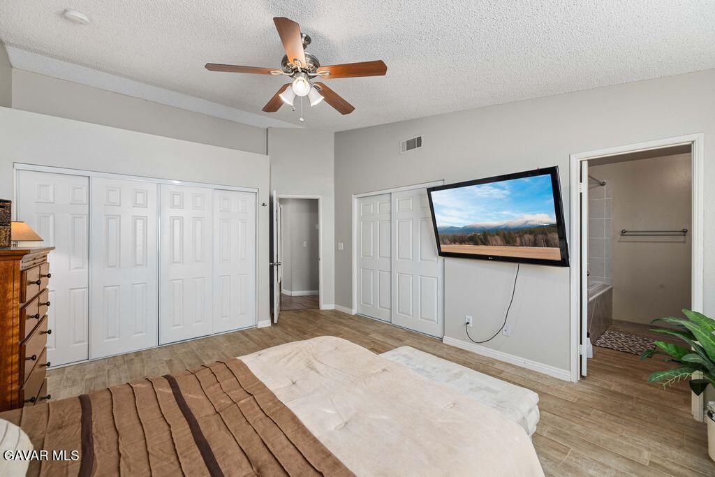 44115 Hunter Court Lancaster, CA 93536 - Photo 12 of 23 a bedroom with a bed and a dresser