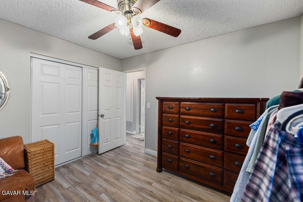 44115 Hunter Court Lancaster, CA 93536 - Photo 21 of 23 a view of livingroom with furniture and wooden floor