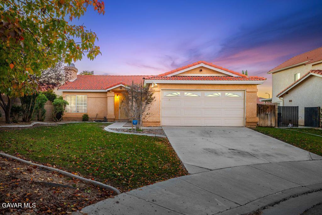 44115 Hunter Court Lancaster, CA 93536 - Photo 22 of 23 a front view of a house with a yard