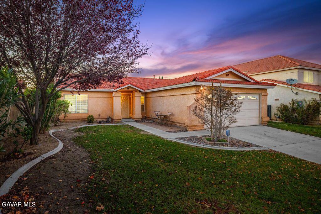 44115 Hunter Court Lancaster, CA 93536 - Photo 23 of 23 a front view of a house with garden