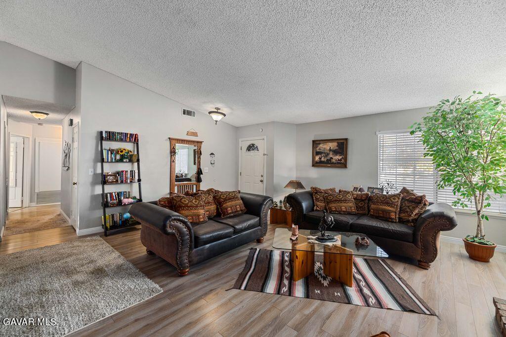 44115 Hunter Court Lancaster, CA 93536 - Photo 4 of 23 a living room with furniture and a couch