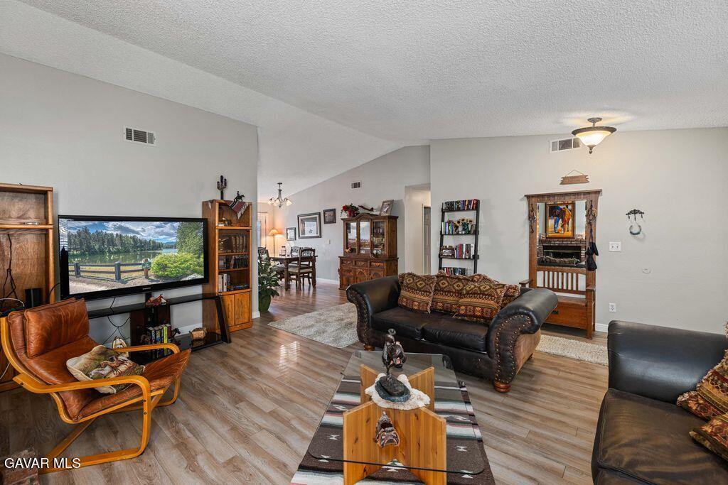 44115 Hunter Court Lancaster, CA 93536 - Photo 5 of 23 a living room with furniture and wooden floor