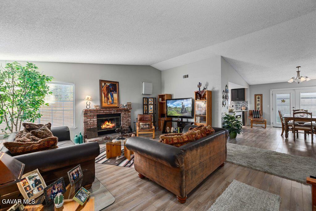 44115 Hunter Court Lancaster, CA 93536 - Photo 6 of 23 a living room with furniture and a fireplace