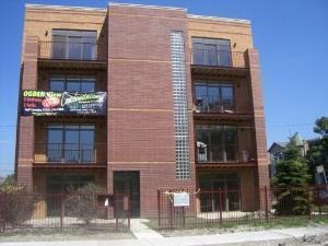 3336 West 19th Street, Unit 1W Chicago, IL 60623 - Photo 1 of 10 a building that has a sign on it