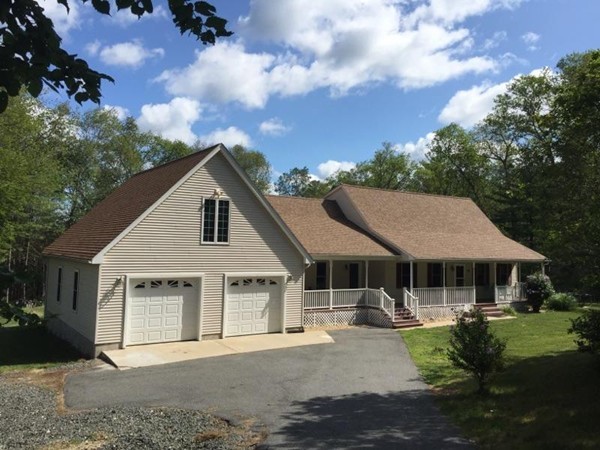 70 Bacon Road Ware, MA 01082 - Photo 1 of 30 a front view of a house with a garden and trees