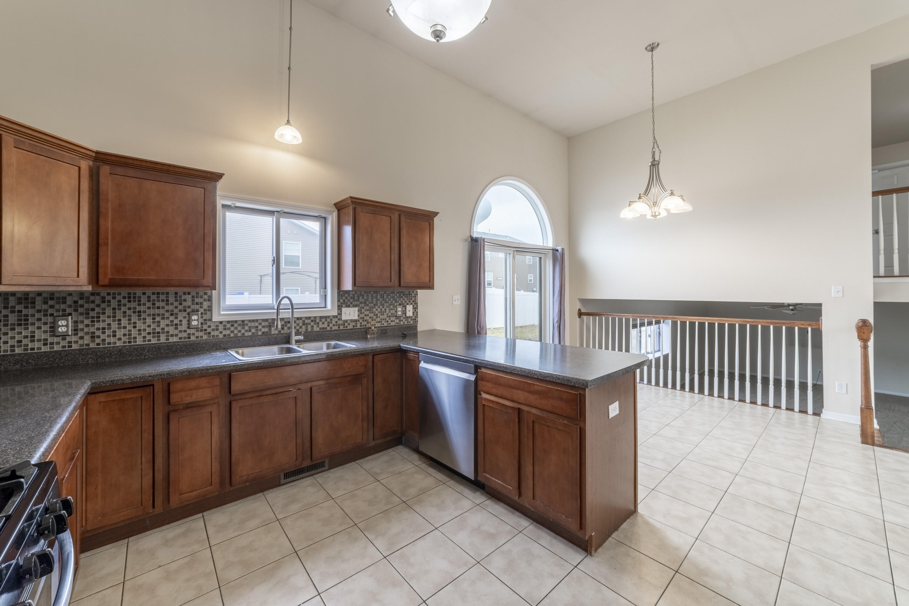 12719 Wheeler Street Cedar Lake, IN 46303 - Photo 14 of 48 a kitchen with stainless steel appliances granite countertop a sink and a stove