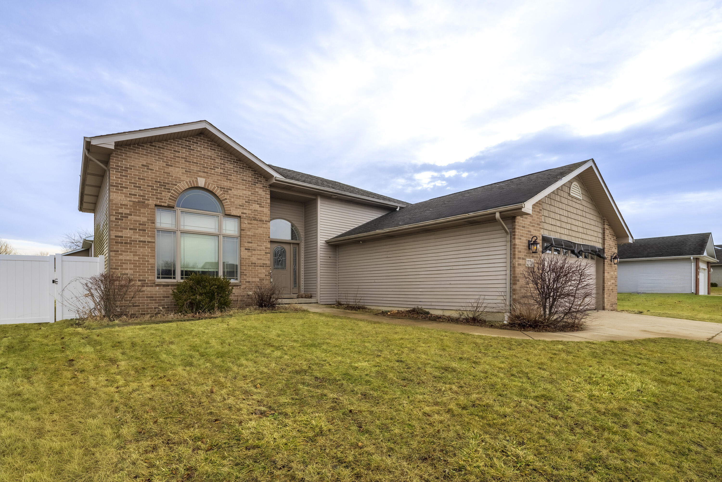 12719 Wheeler Street Cedar Lake, IN 46303 - Photo 2 of 48 a view of a house with big yard and large tree