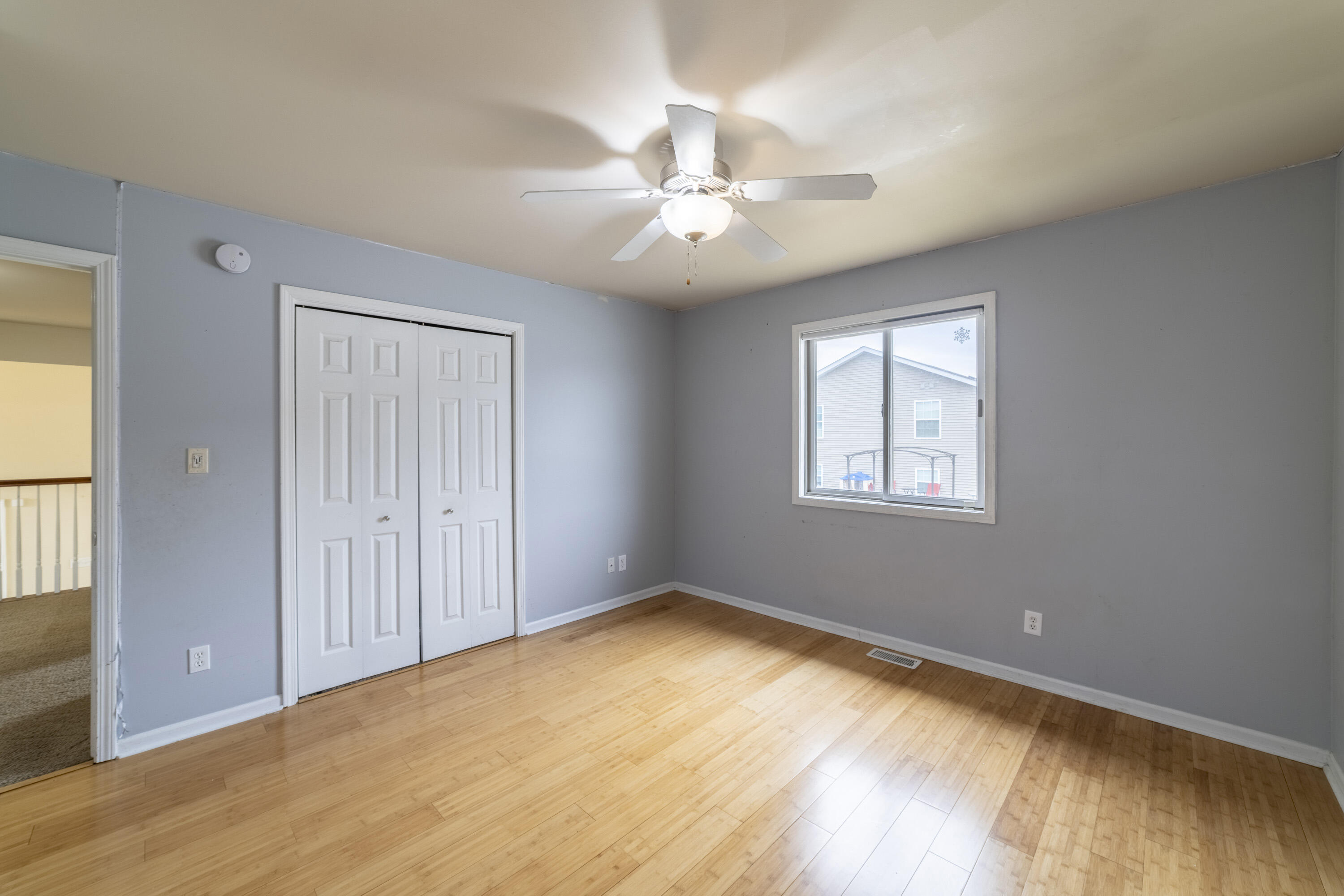 12719 Wheeler Street Cedar Lake, IN 46303 - Photo 22 of 48 wooden floor in an empty room with a window