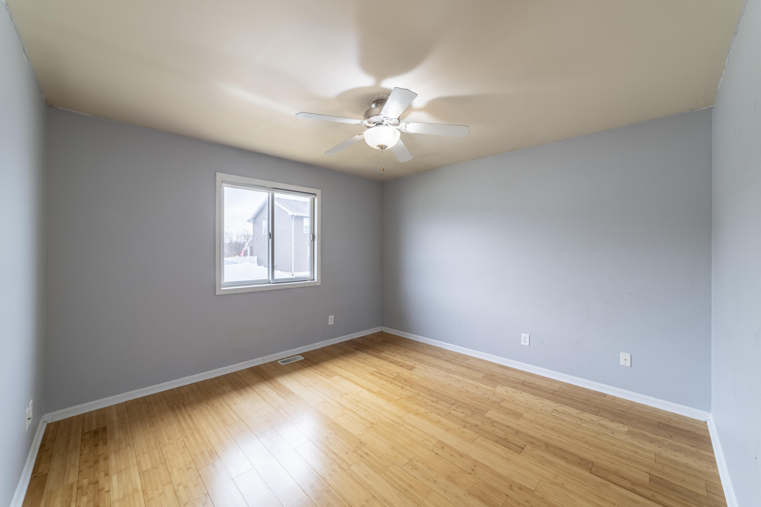 12719 Wheeler Street Cedar Lake, IN 46303 - Photo 23 of 48 an empty room with a window and a ceiling fan