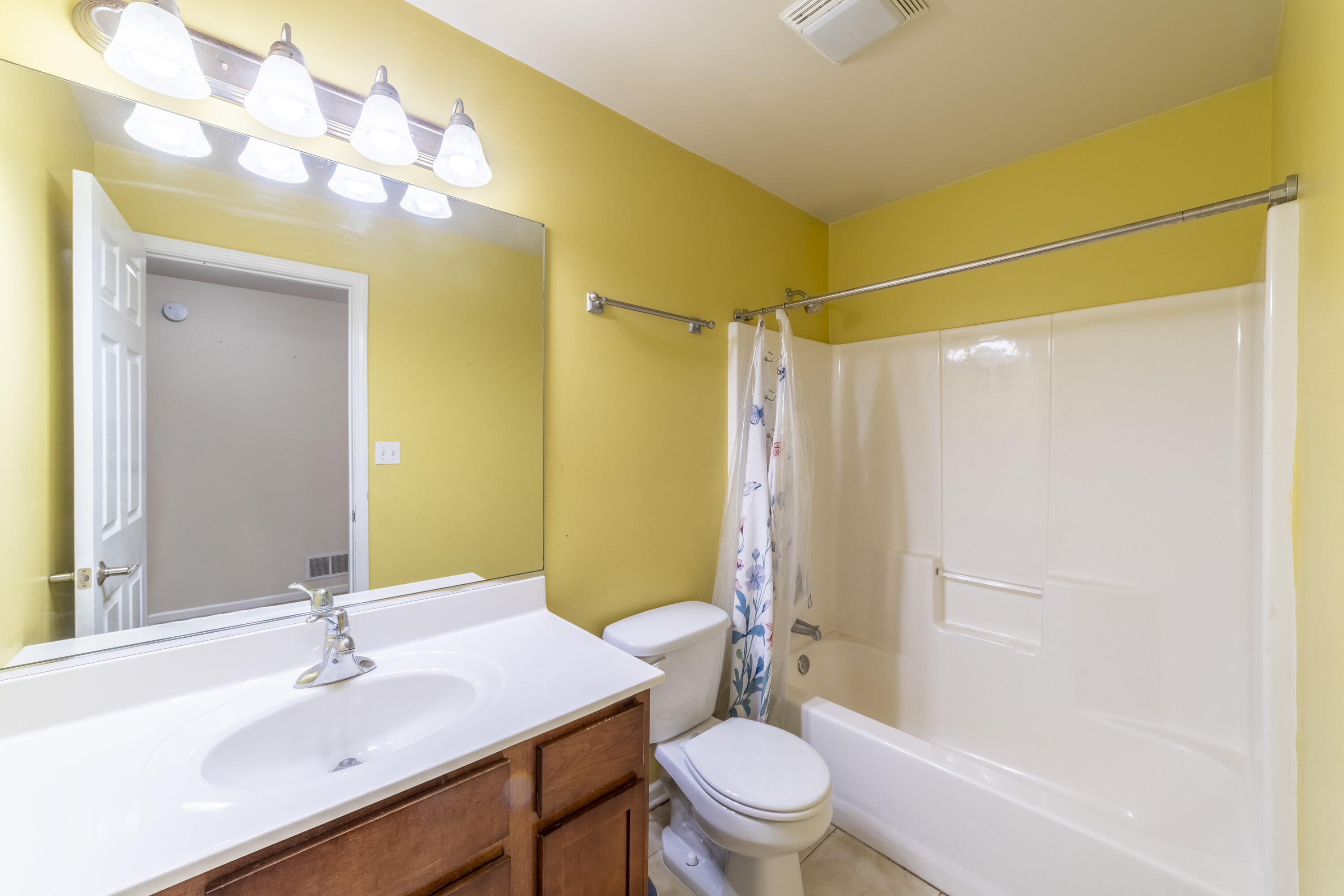 12719 Wheeler Street Cedar Lake, IN 46303 - Photo 26 of 48 a bathroom with a sink toilet and shower