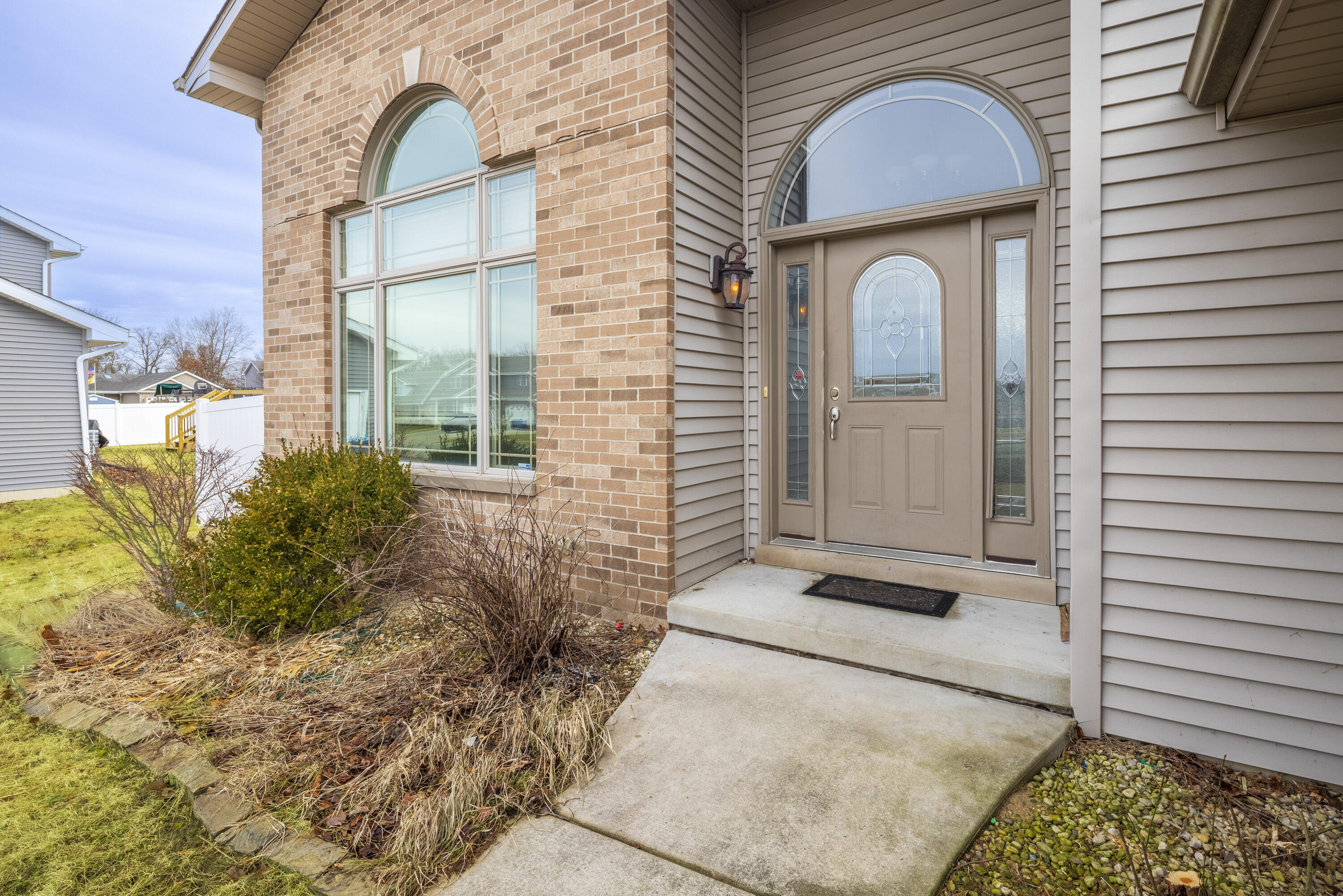 12719 Wheeler Street Cedar Lake, IN 46303 - Photo 4 of 48 a front view of a house with a garden