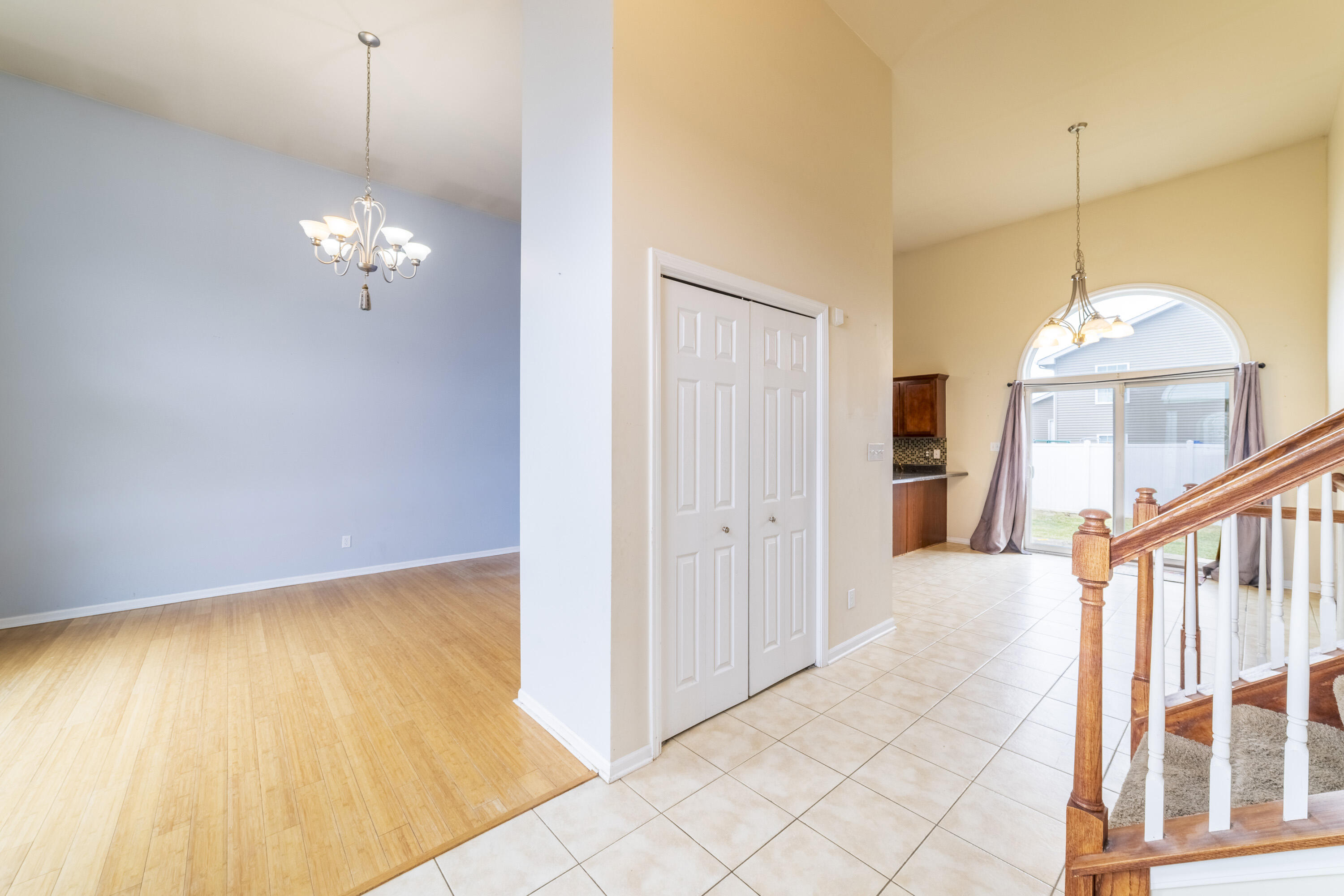 12719 Wheeler Street Cedar Lake, IN 46303 - Photo 7 of 48 a view of a livingroom with wooden floor and a ceiling fan