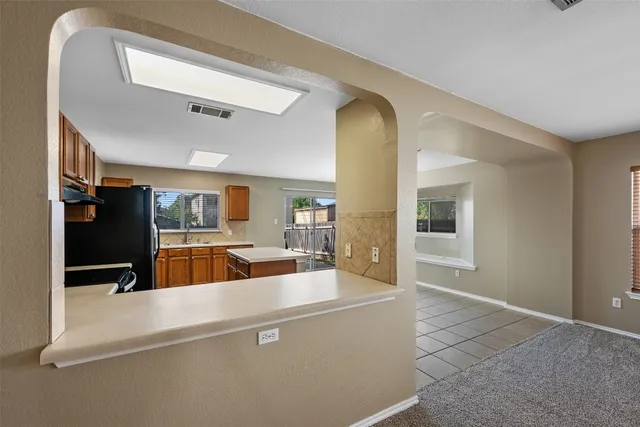 a view of a living room and a flat screen tv