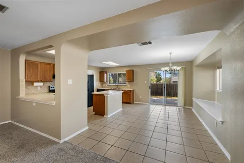 a view of a kitchen and an entryway