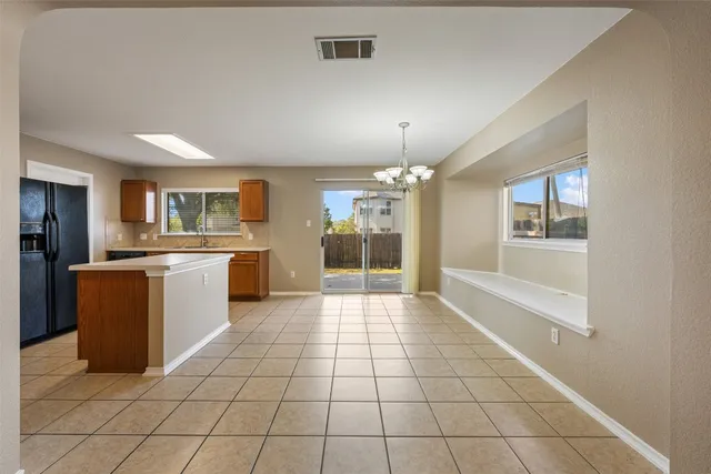a large kitchen with cabinets and stainless steel appliances