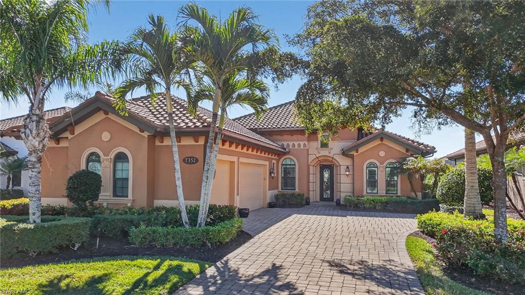 7352 Lantana Way Naples, FL 34119 - Photo 1 of 48 a front view of a house with a garden