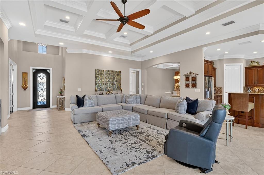7352 Lantana Way Naples, FL 34119 - Photo 11 of 48 a living room with furniture and a large window