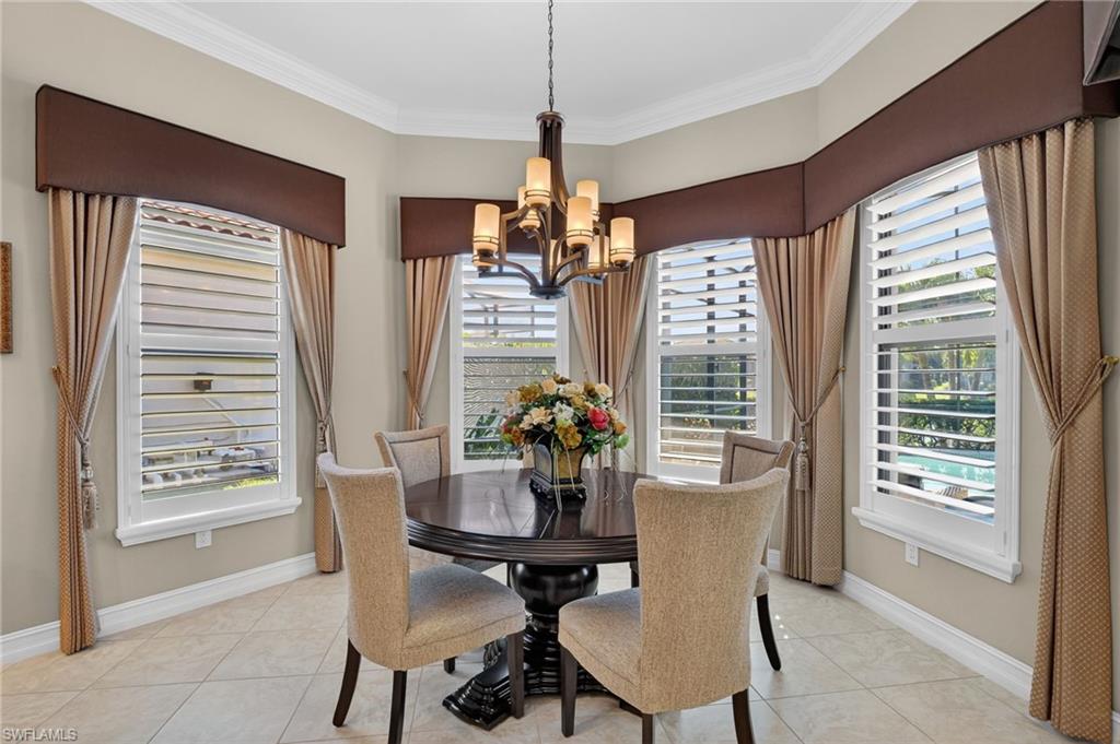 7352 Lantana Way Naples, FL 34119 - Photo 18 of 48 a view of a dining room with furniture window and outside view