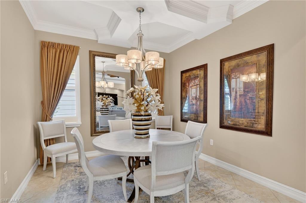 7352 Lantana Way Naples, FL 34119 - Photo 19 of 48 a view of a dining room with furniture and chandelier