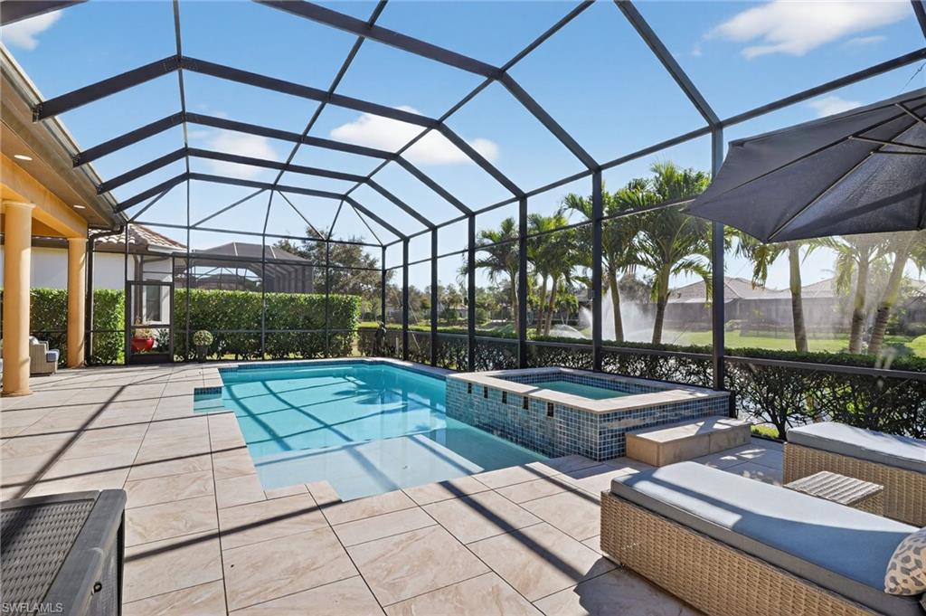 7352 Lantana Way Naples, FL 34119 - Photo 37 of 48 a view of a swimming pool with a patio