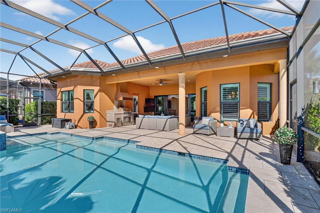 7352 Lantana Way Naples, FL 34119 - Photo 38 of 48 a view of a house with backyard porch and sitting area