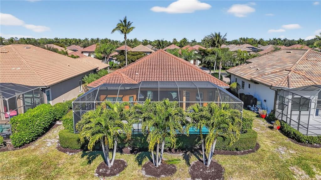 7352 Lantana Way Naples, FL 34119 - Photo 39 of 48 a aerial view of a house with a yard and potted plants
