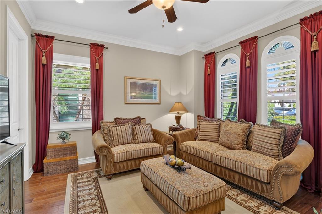 7352 Lantana Way Naples, FL 34119 - Photo 5 of 48 a living room with furniture and a large window