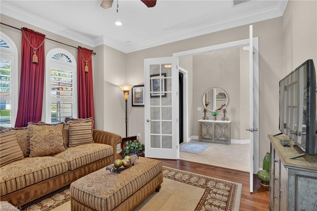 7352 Lantana Way Naples, FL 34119 - Photo 7 of 48 a living room with furniture and a window