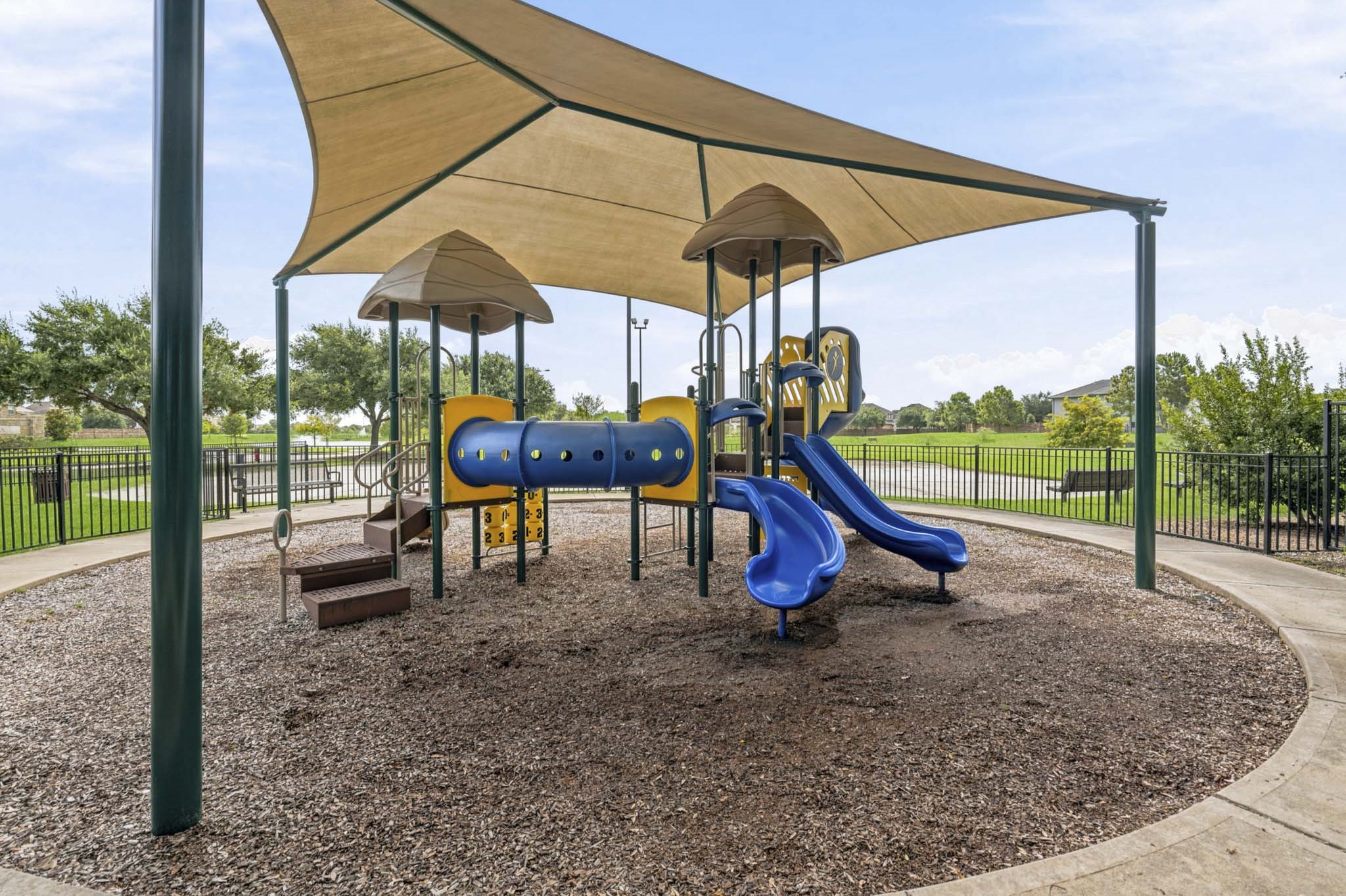 12115 San Luca Street Richmond, TX 77406 - Photo 39 of 44 Little ones will love the thoughtfully designed playground complete with shaded structures and room to explore. It's an ideal gathering spot where memories are made and neighborhood friendships begin.